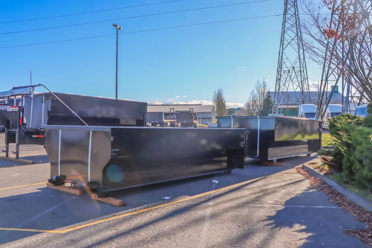 Roll-off dumpster ready for waste disposal at job site for Demolition Dumpster Rental in De Witt